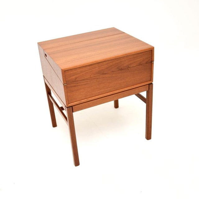 A lovely and rare Swedish vintage teak work box / side table by Sven Engstrom and Gunnar Myrstrand. This was made in...