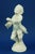 Beautiful, rare, white enameled earthenware sculpture, depicting a monkey musician, specifically an orchestra conductor...