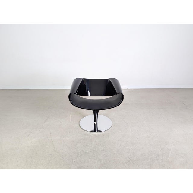 We are offering a beautiful lounge armchair from the renowned Swiss manufacturer ZÜCO for sale. This swivel chair,...
