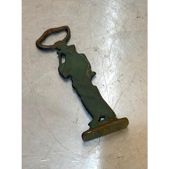 1950s-60s abstract figural green metal bottle opener. Excellent condition.