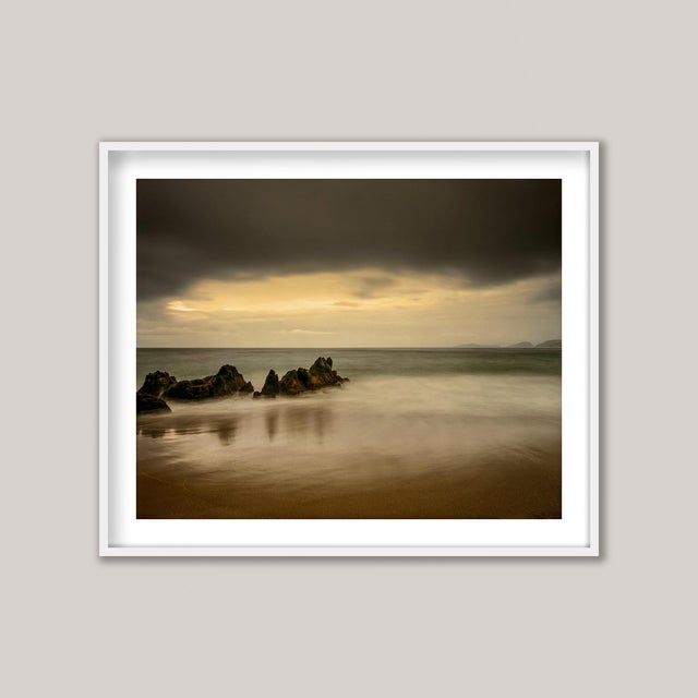 Arriving before dawn, only the faintest glow illuminated the horizon. I carefully made my way down to the sandy beach...