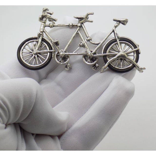 This Italian silver miniature is a delightful and intricate representation of a classic tandem bicycle, masterfully...