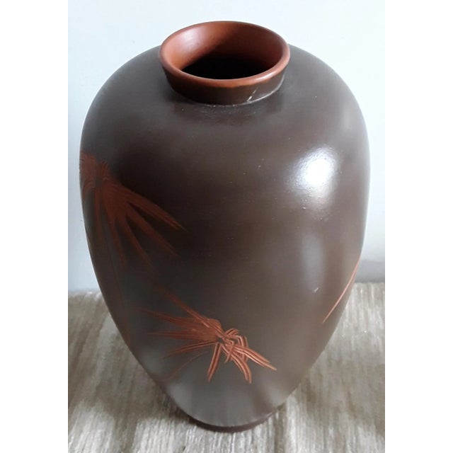Handmade brown german vintage ceramic vase with incised floral decoration in red from the 60s