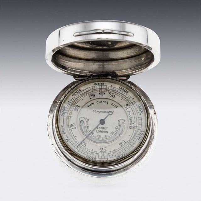 Antique 20th century english solid silver cased barometer. The case is of a smooth, circular form with a hinged lid...