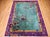 A vibrant expression of early 20th-century Chinese Art Deco design, this hand-knotted rug features a serene green field...