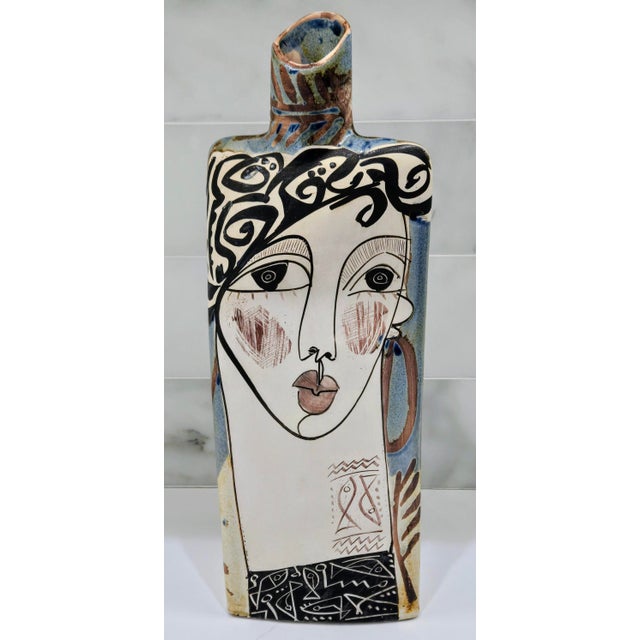 A striking Spanish modernist stoneware vase by Alfajar Ceramica, hand painted with a bold abstract female face and...