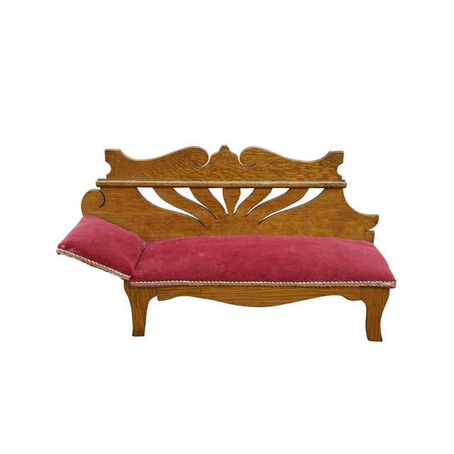 Antique Victorian miniature salesman sample / doll sized fainting couch / chaise lounge chair. Features a carved quarter...