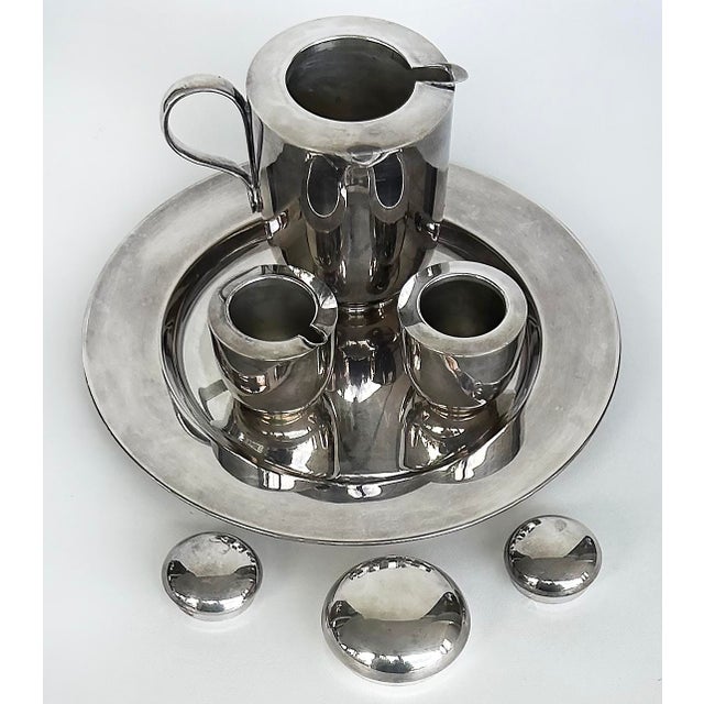 Dansk Silver-Plated Brass Tea Set Designed by V. Lorenzo Porcelli Offered for sale is a silver-plate on brass tea set...