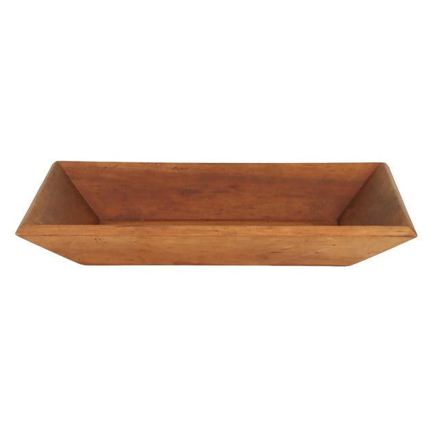A primitive style rectangular antique dough bowl or trencher bowl. Since colonial times these wooden bowls were found in...