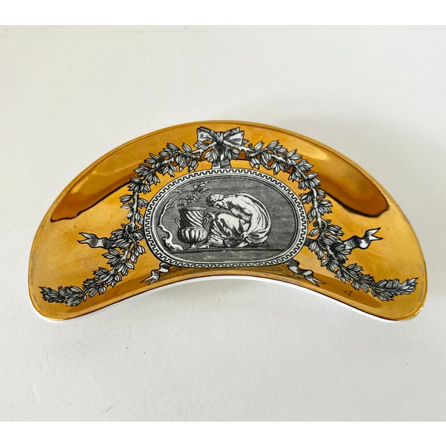 Single vide poche or catchall porcelain tray designed by Piero Fornasetti. #5 in the 6 piuece "Medaglioni" series. 8-1/4"...