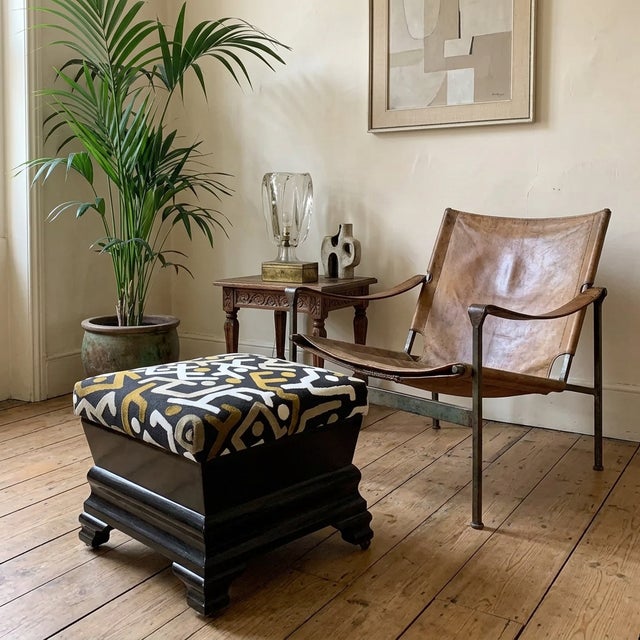 American Eastlake Victorian footstool from the 1880-90s in ebonized oak with a rich black finish. Newly upholstered in...