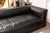 A Four Hands "Nolita" black leather sofa. This is a gorgeous black leather sofa featuring a chic reverse stitching design....