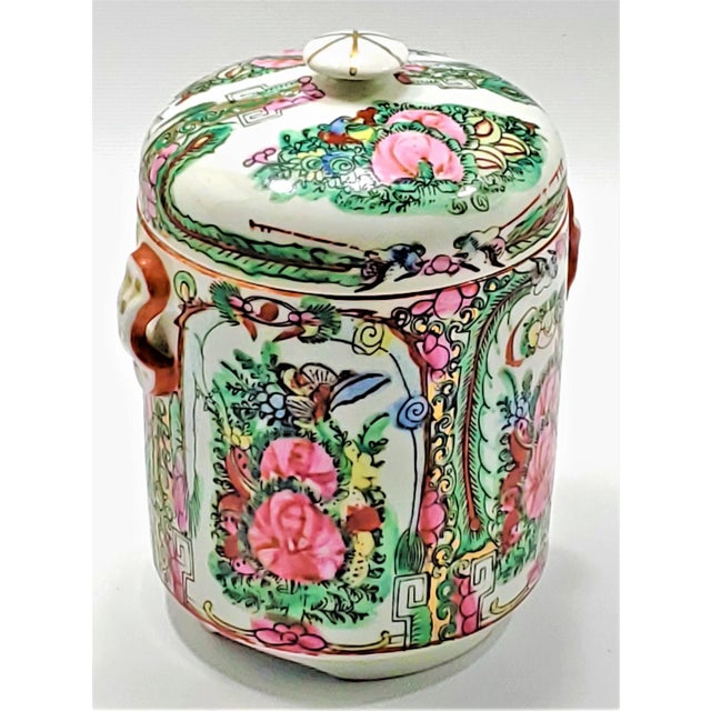 Offering a very unique vintage Chinese Porcelain Tea Canister With Phoenixes, Butterflies and Pink Peony Flowers. Most...