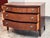 Design Plus Gallery presents a Vintage Federal-Style Mahogany Serpentine Chest of Drawers. The chest displays figured...