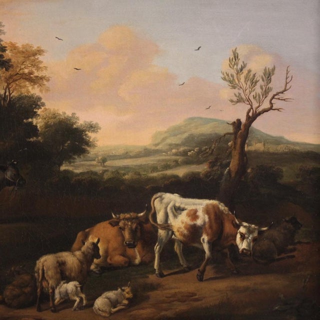 Antique 18th-century Flemish painting. Oil on canvas artwork depicting a delightful bucolic landscape with animals and...
