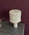 Handmade ceramic table lamp with a textured stoneware surface and neutral glaze. The lamp features a sculptural ceramic...