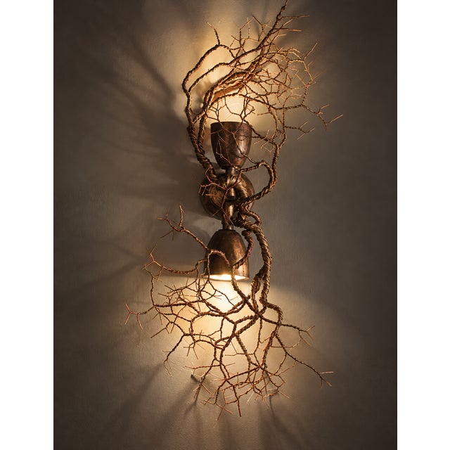 The art of grounding together sculptural up & down wall light — frankie cesare for f+m fos two people. Two directions. One...