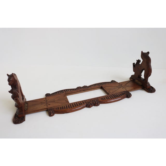 Exquisite & rare! This 19th century black forest books rack/ book shelf with ''Bears holding baby bears'' bookends hand...