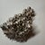A Laminato AG grape cluster sculpture from Italy, in resin elegantly plated in 925 sterling silver, with green leaves. The...