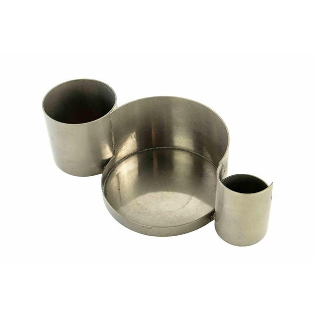 Desk set realized around 1950s. Total 5 aluminum pieces. Dimensions pen holder n.1 l 34,5 x h16 x d 6 cm. Holder n.2 l 21...