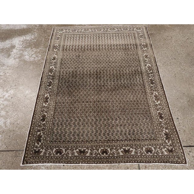 This Mid-20th century Persian Afshar rug, measuring 3' 7" x 4' 10", is a striking example of tribal weaving traditions...