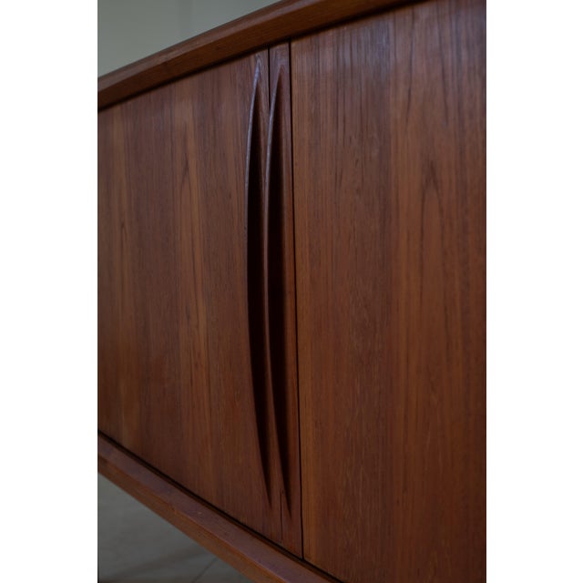 Rare 1960's Bernhard Pedersen & Son Teak Credenza with Tambour doors. Interior has three felt-lined sliding, dovetail...