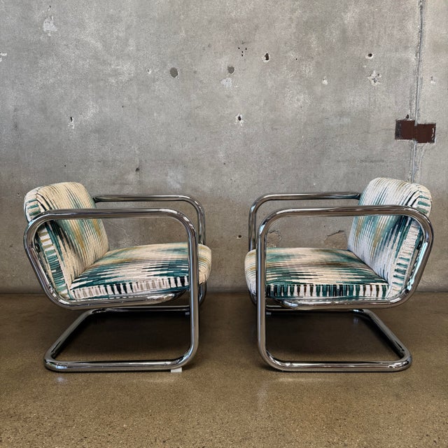 Add a striking dash of Mid-Century modern flair to your space with this stunning pair of vintage 1970s chrome cantilever...