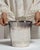 This mid 20th century ice bucket from France is finished in white, worked in silver. Its form follows honest, well-...