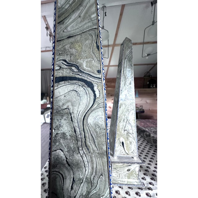 Made from tin. I purchased these from an estate sale in MA. I was told by a family member that these were decorated by a...