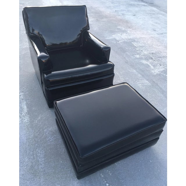 Sleek black patent leather club chair and ottoman, manner of Edward Wormley for Dunbar-Berne, circa 1957. Piece...