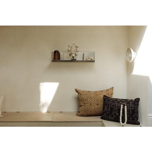 A striking cushion made from authentic Showa cloth — a form of Kuba textile from the Democratic Republic of Congo. Each...