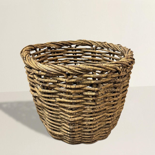 Crafted with an artisan’s touch and a deep appreciation for natural materials, this 20th-century American hand-woven...