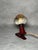 A small 1960s Bakelite reading lamp with a clamp mount. The lamp features a burgundy body and a mustard-coloured rotating...