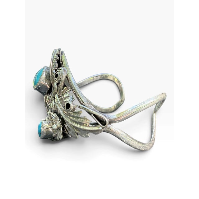 Vintage Navajo sterling silver cuff by Harry B. Yazzie, signed HBY and stamped Sterling. The sculptural design centers two...