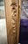 This stunning gold mirror features intricate, floral carvings along the wooden frame. The mirror itself has a slight...