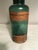 Wonderful early 1900s Apothecary Jar. It is dark bottle green, 7” high, and still has the original MERCK labels and...