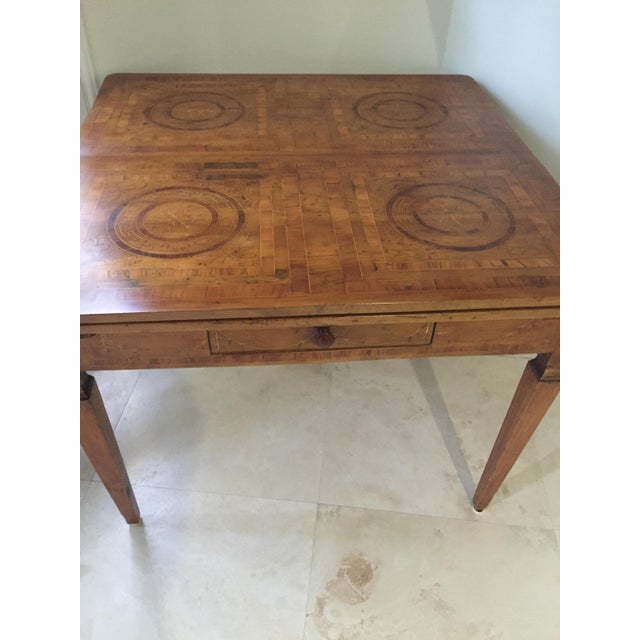 18th-century Danish expandable dining table. Wood inlay. Has a functioning drawer on one side. Expandable with leaves that...
