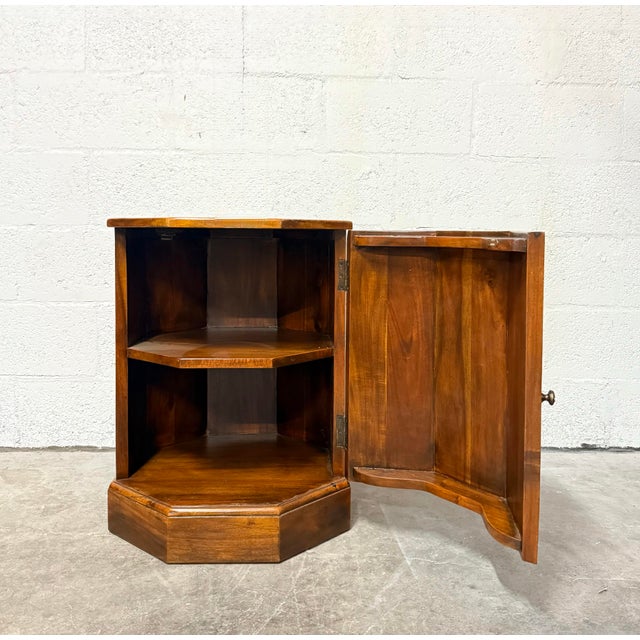 Vintage Theodore Alexander faux book side table featuring a rich, warm brown finish and a faceted cabinet form....