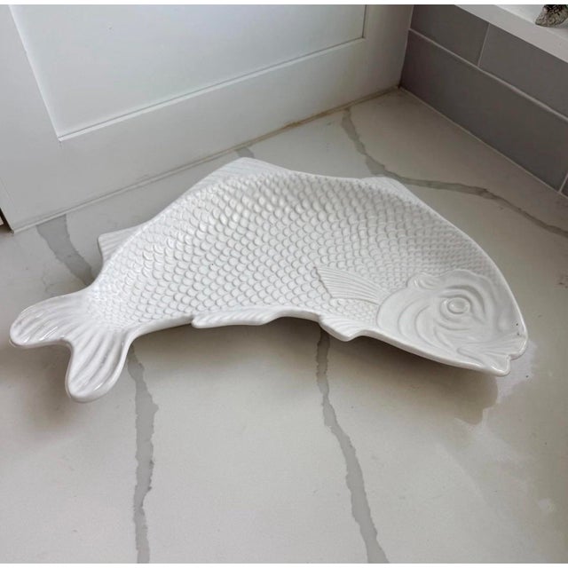 Capture the timeless appeal of coastal style with this striking vintage white majolica fish serving platter. Crafted in...