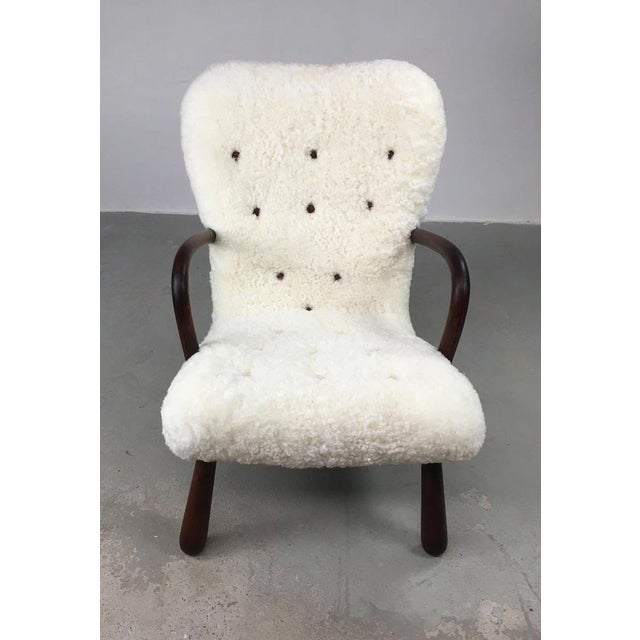 1950's Original fully restored Danish clam chair in sheepskin by Skive Møbelfabrik The “Clam” chair is by some considered...