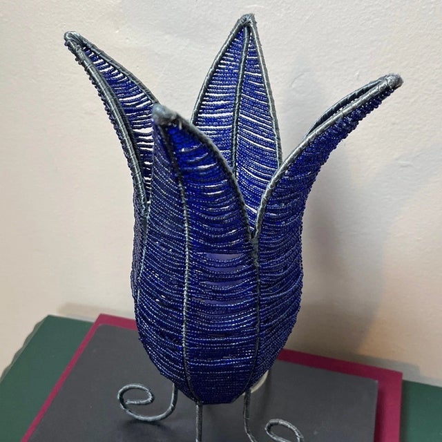 Add a bold pop of retro charm to your space with this stunning Vintage 1990s Royal Blue Beaded Tulip Lamp. Featuring a...