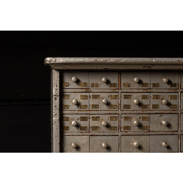Handpicked by IndustrialArtifact Vintage from the 1930s About this item Industrial wooden cabinet with a silver and gray...