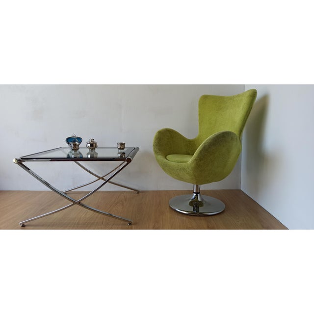 Bucket chair in chrome and green. Original, interesting shape. Heavy and stable. Functional and nice-looking piece of...