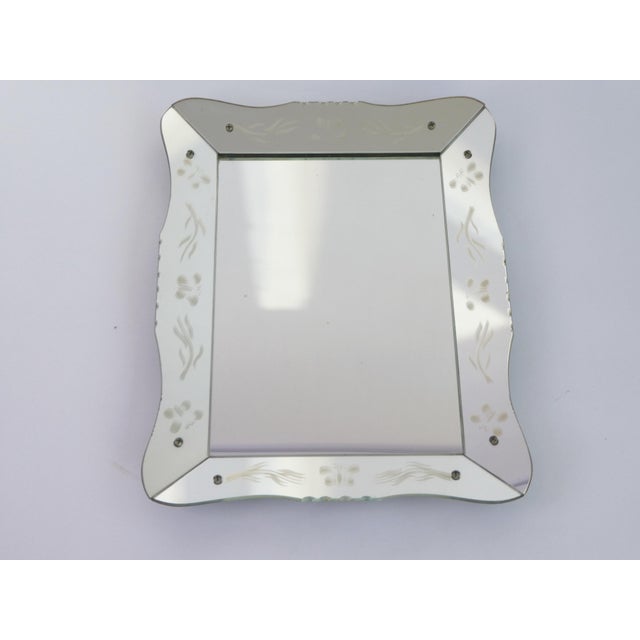 Vintage Venetian ornate rectangular mirror. The frame of the mirror has nice floral details and curved edges that give it...