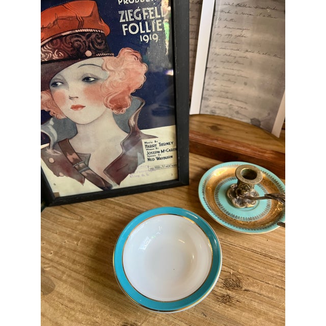 Up for consideration is a beautiful vintage Tiffany blue rimmed catchall with gold accents. This would look lovely in your...