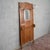 A vintage entryway coat rack dating back to the early decades of the 20th century, characterized by clean lines and a...