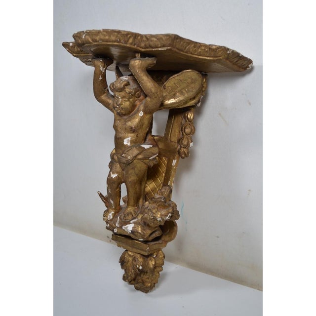 France XVIIIth Century Small Wall Bracket in Stuccoed and Gilded Wood, the Scalloped Top Supported by Zéphir For Sale - Image 4 of 13