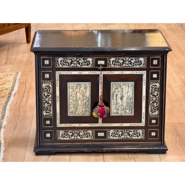An early 17th century Italian heavily inlaid traveling cabinet from Lombardy, veneered with macassar and inlaid with...