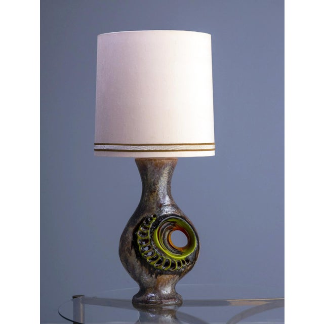 This ceramic lamp was produced in Germany in the 1970s and reflects the sculptural, textured ceramic design characteristic...