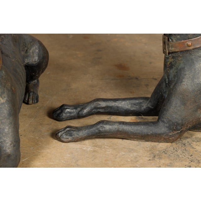 This captivating pair of American J.W Fiske iron greyhound dog sculptures from the late 19th century embodies both the...